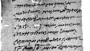 Schwarz-weiß Abbildung eines Textes auf Papyrus. Der Inhalt der Schrift: Eine Musiktruppe wird zur Unterhaltung bei einem Fest engagiert (P. Heid, IV 328; 3. Jhdt. n. Chr.)