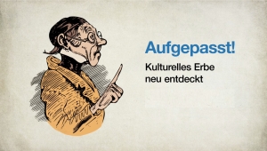 Lehrer Lämpel zeigt mit dem Zeigefinger auf den Titel der Filmreihe "Aufgepasst! Kulturelles Erbe neu entdeckt.